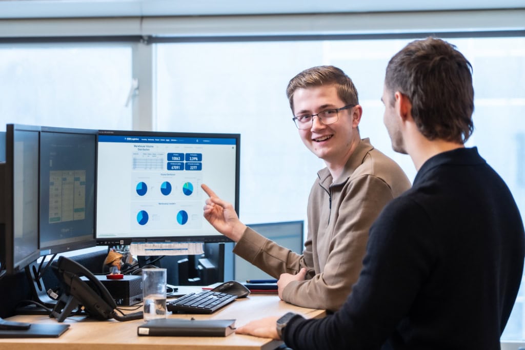 Colleagues in front of computer screen